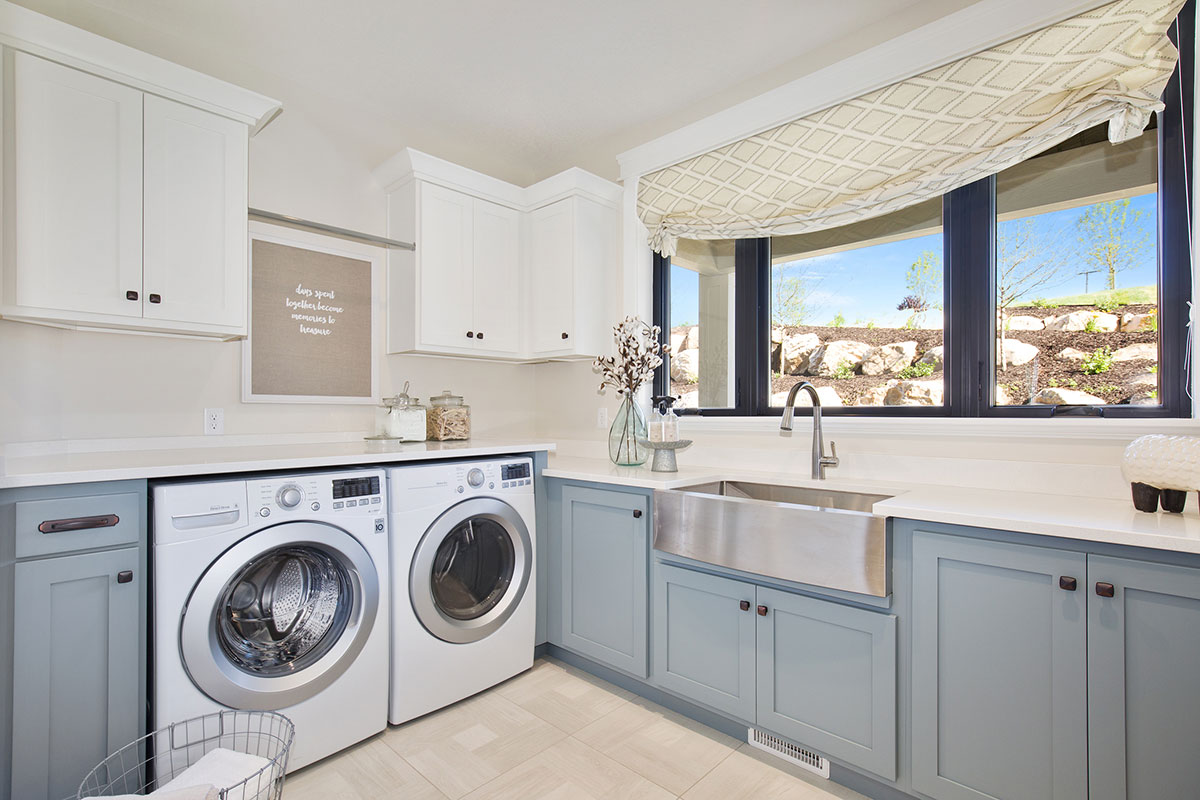 laundry room with utility sink and storage