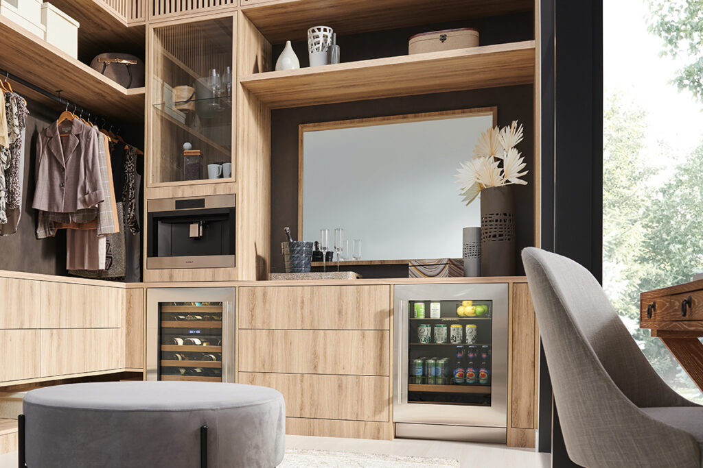 Sub-Zero undercounter beverage and wine storage in walk-in closet coffee bar.